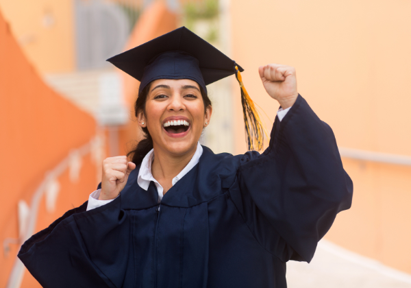 Female graduate in black cap and gown.