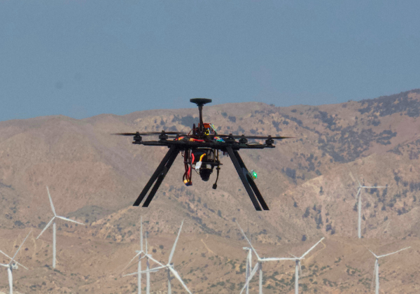 UAV flys in desert sky