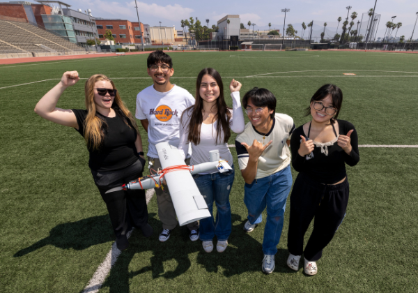 students celebrate UAV on field