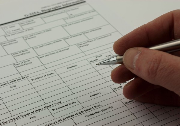 hand filling out form