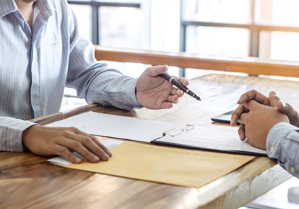 people filling out paperwork