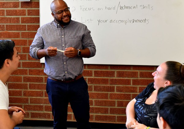 Career advisor presents career skills to students.