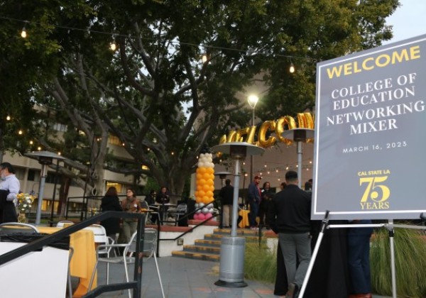 Welcome balloons and sign that reads Welcome College of Education Networking Mixer