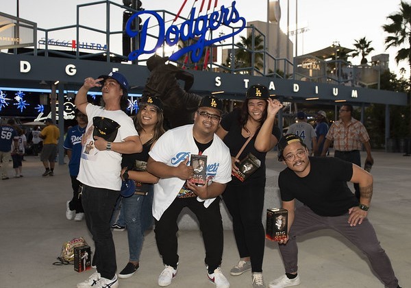 Group of five alumni posing and having fun at Cal State LA Dodger Night 2022