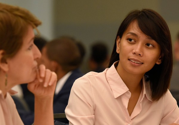 student listens to industry rep