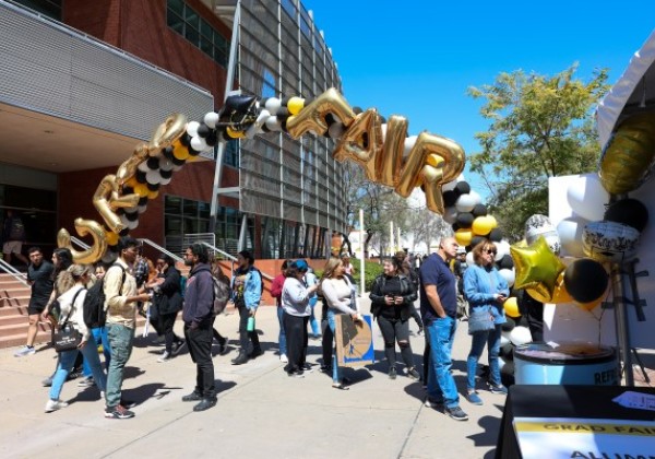 Balloon arch spelling out the words GRAD FAIR 