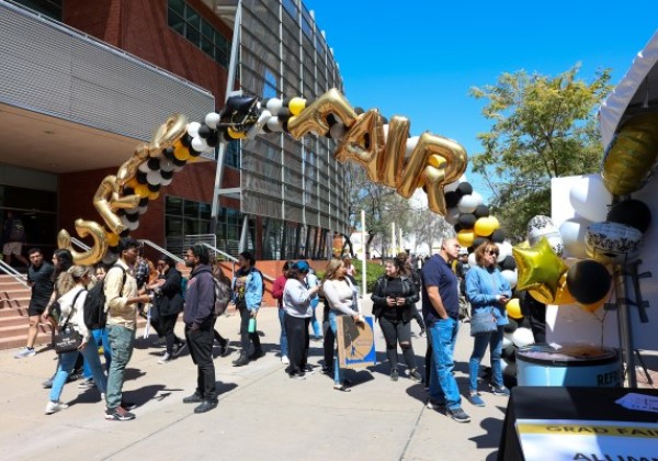 Balloon arch spelling out the words GRAD FAIR
