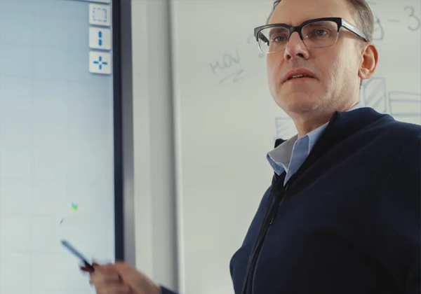 instructor pointing to a screen