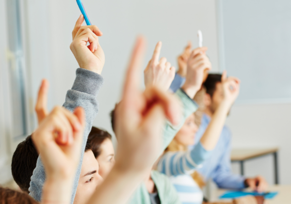 Students raising hands