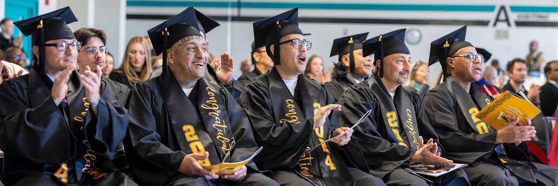 Graduates in cap and gown from LA County Prison