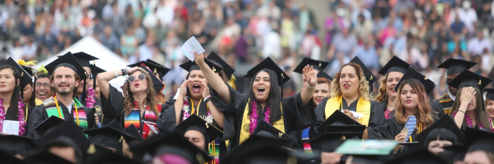 Student cheering at comencement