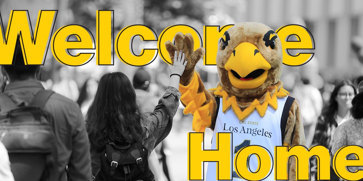 Eddie the Golden Eagle high-fiving a student. Welcome Home.