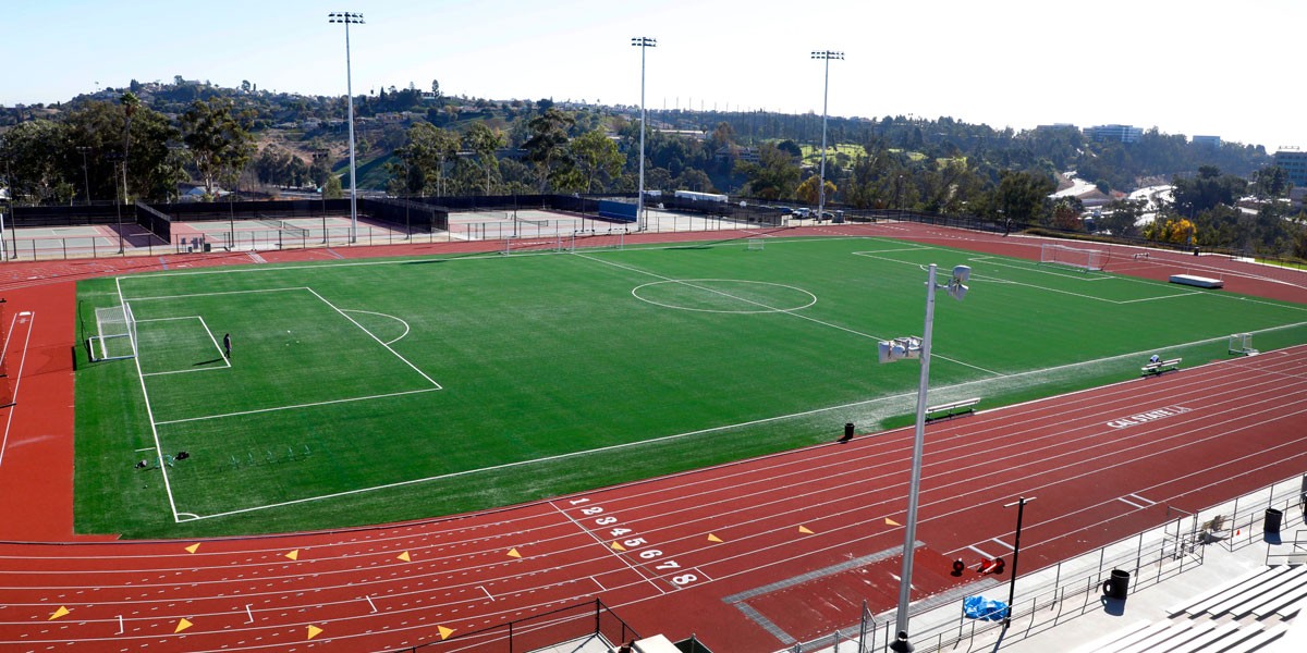 A track and field on a sunny day.