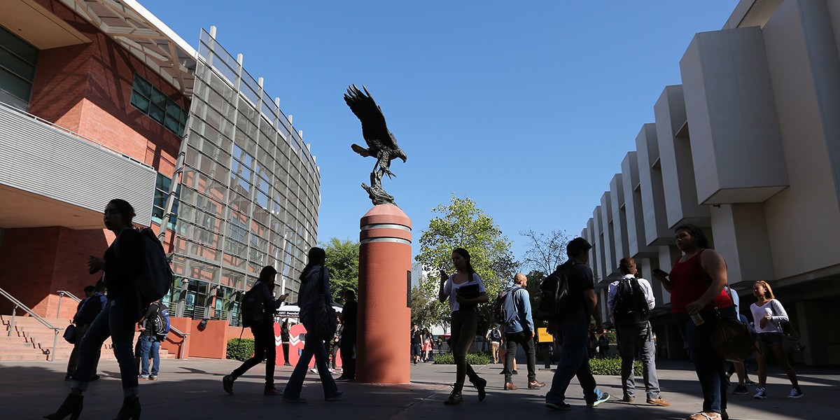 Students walking across Golden Eagle Plaza