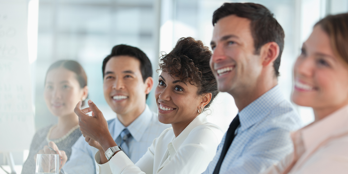 A happy business meeting in a bright room. 