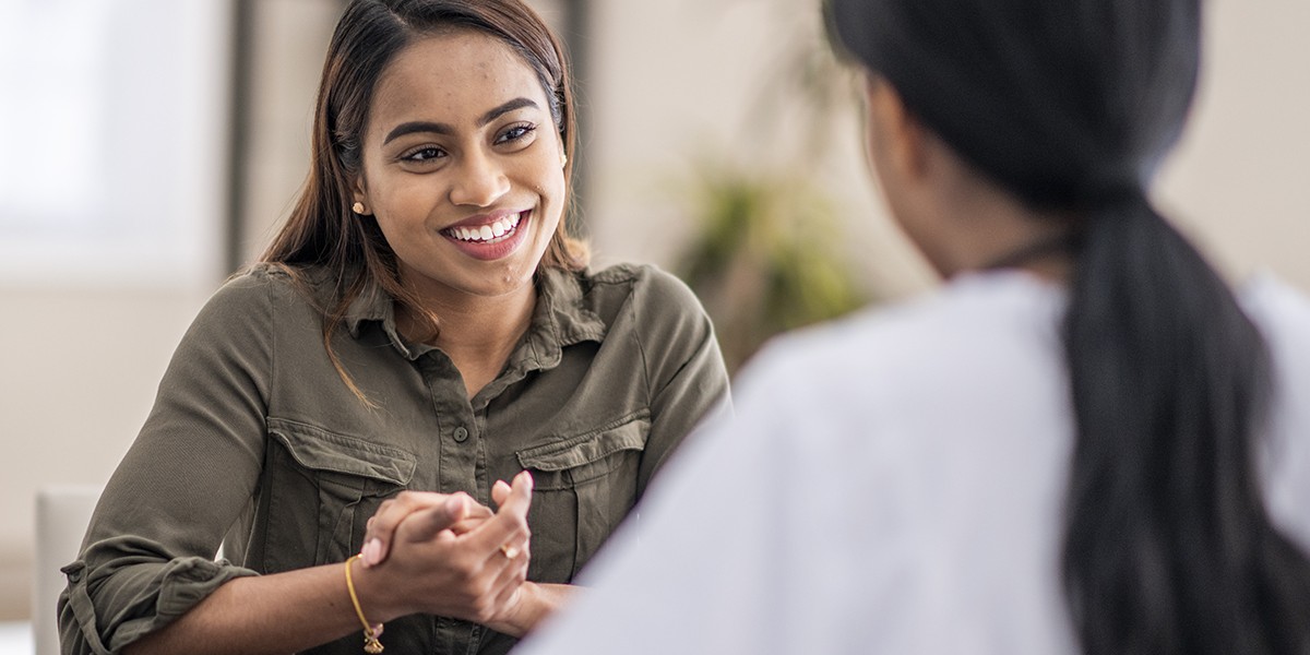 Young Woman Consulting with Public Health Worker