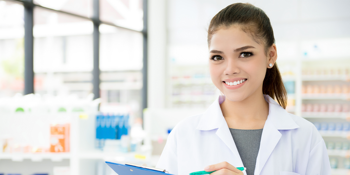A smiling pharmacy worker. 