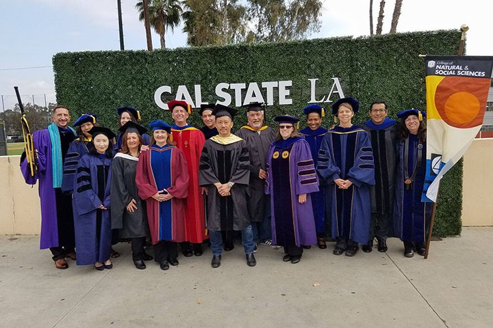 A group of Sociology faculty wearing regalia at Commencement