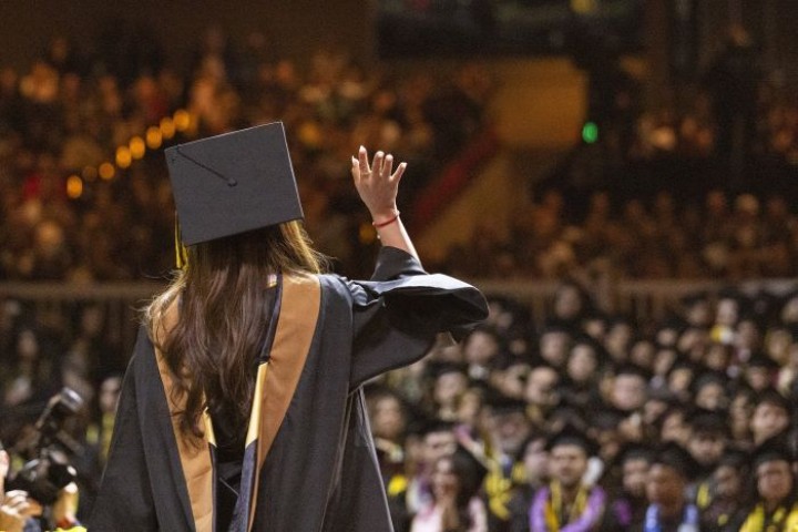 graduate looking into crowd on stage