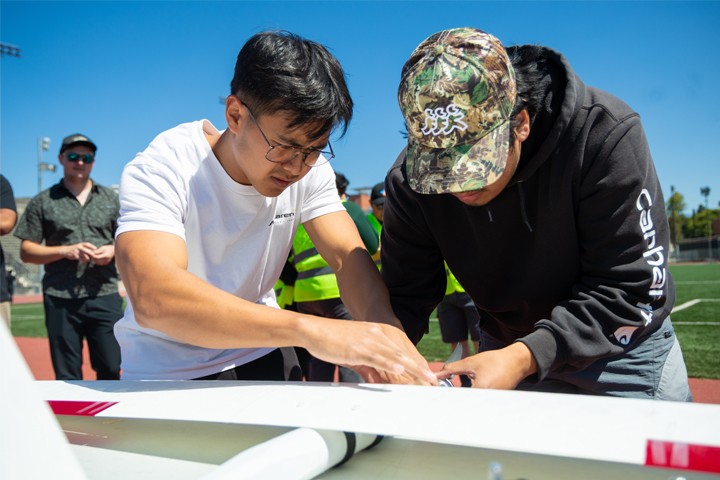 C3DPAC 2026 students working on UAV on field