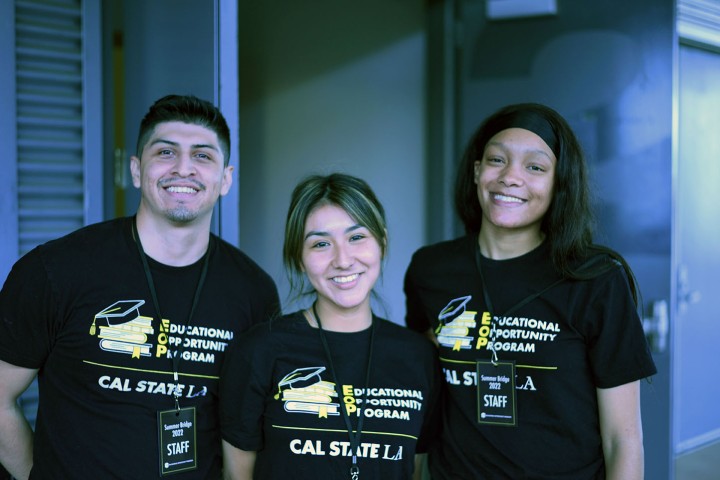 Three people smiling and wearing t-shirts for the Educational Opportunity Program.