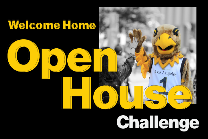 Eddie the Golden Eagle high-fiving a student. Welcome Home Open House Challenge