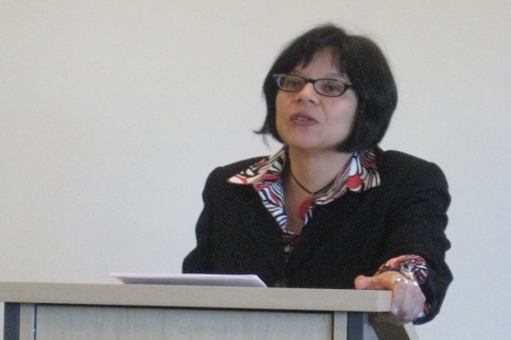 M Ortega at lectern