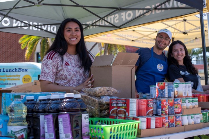 workers at the food pantry pop up smiling