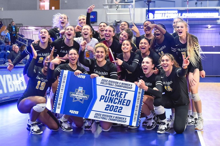 The Cal State LA Women's Volleyball team celebrating a victory.