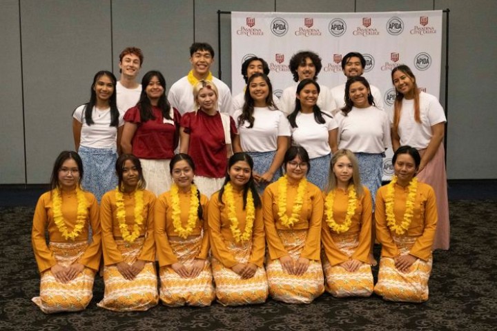 Students in traditional dress at a cultural performance