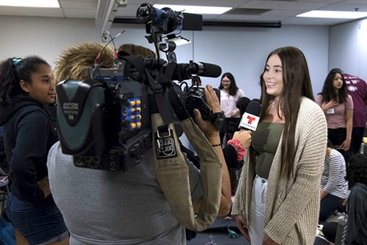 girl being interviewed on camera