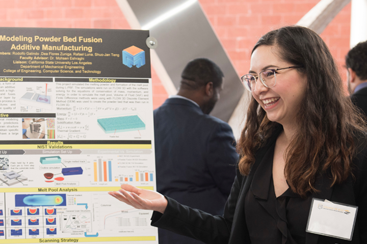 female student presents project poster at expo