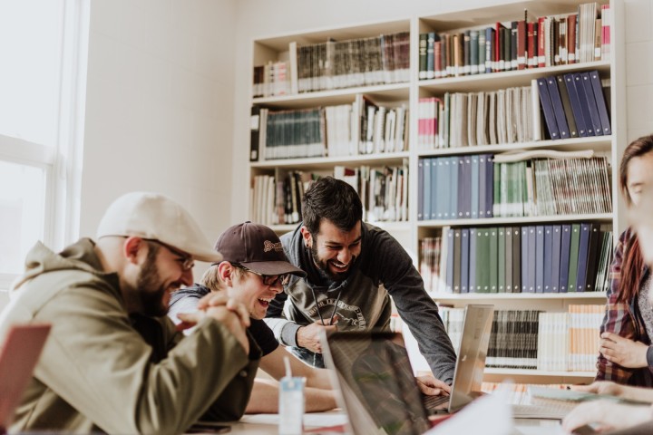 Group of students working together in a library