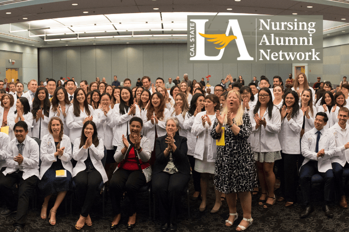 A group of about 50 people wearing white coats posing on the ice at Crypto.com Arena