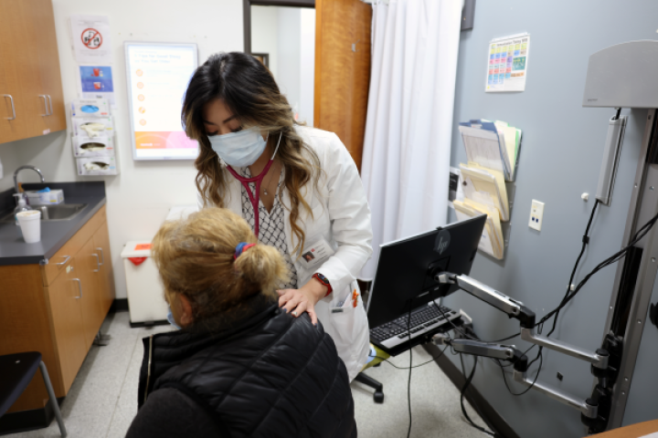 Student helping patient. 