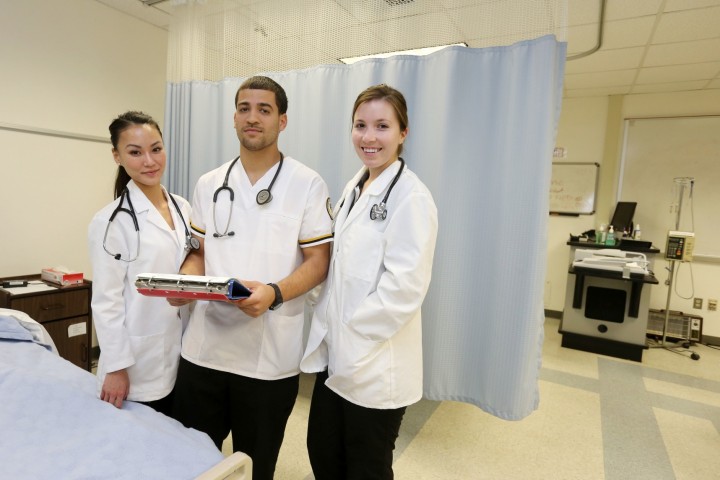 Three students in the simulation lab.