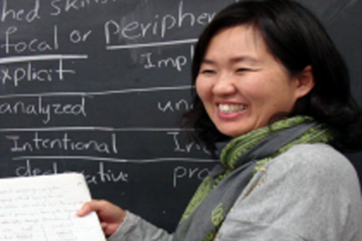 Student Smiling and Teaching