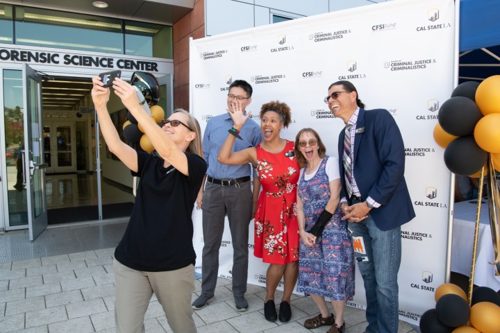 Faculty posing outside 