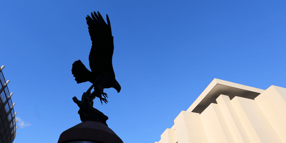 Outline of Golden Eagle Statue against a bright blue clear sky