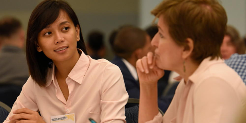 female students works with advisor