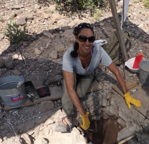 Amira Ainis working in the field