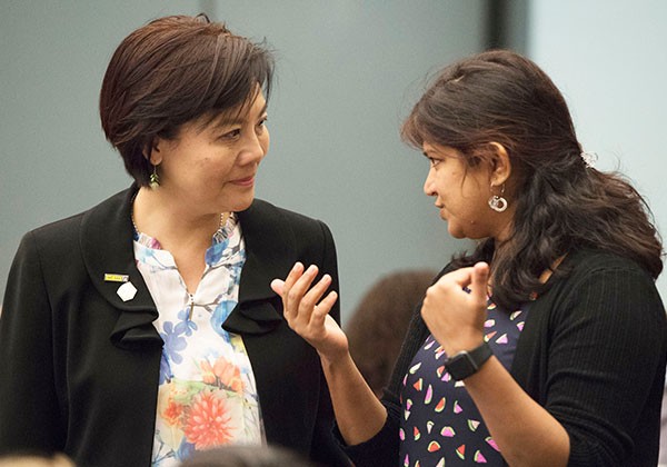 Two professors engaging in a discussion