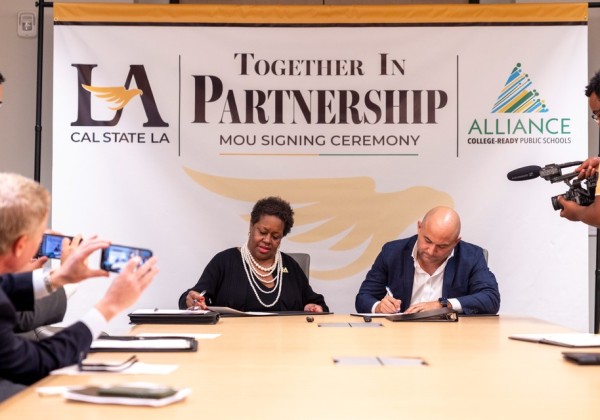 Cal State LA and Alliance College-Ready Public Schools representatives sign a memorandum of understanding during a partnership ceremony.