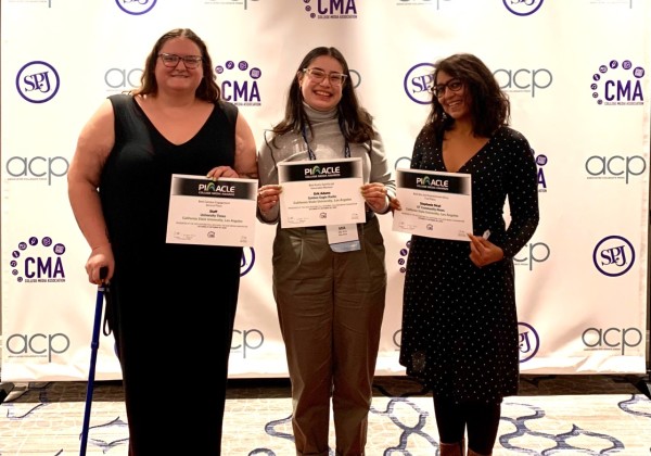 University Times Managing Editor Victoria Ivie, Editor-in-Chief Mia Alva and Advisor Julie Patel Liss accept the awards.
