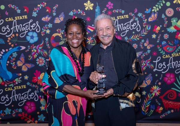 Actor-director-producer Edward James Olmos accepts the Prism Award from Cal State LA President Berenecea Johnson Eanes on Friday, Oct. 10, 2025. The award is given to creators for their outstanding contributions to diversity in speculative media.
