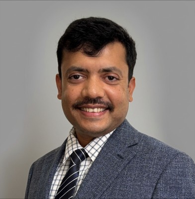 A professional photo of Dr. Mijanur Rahman
