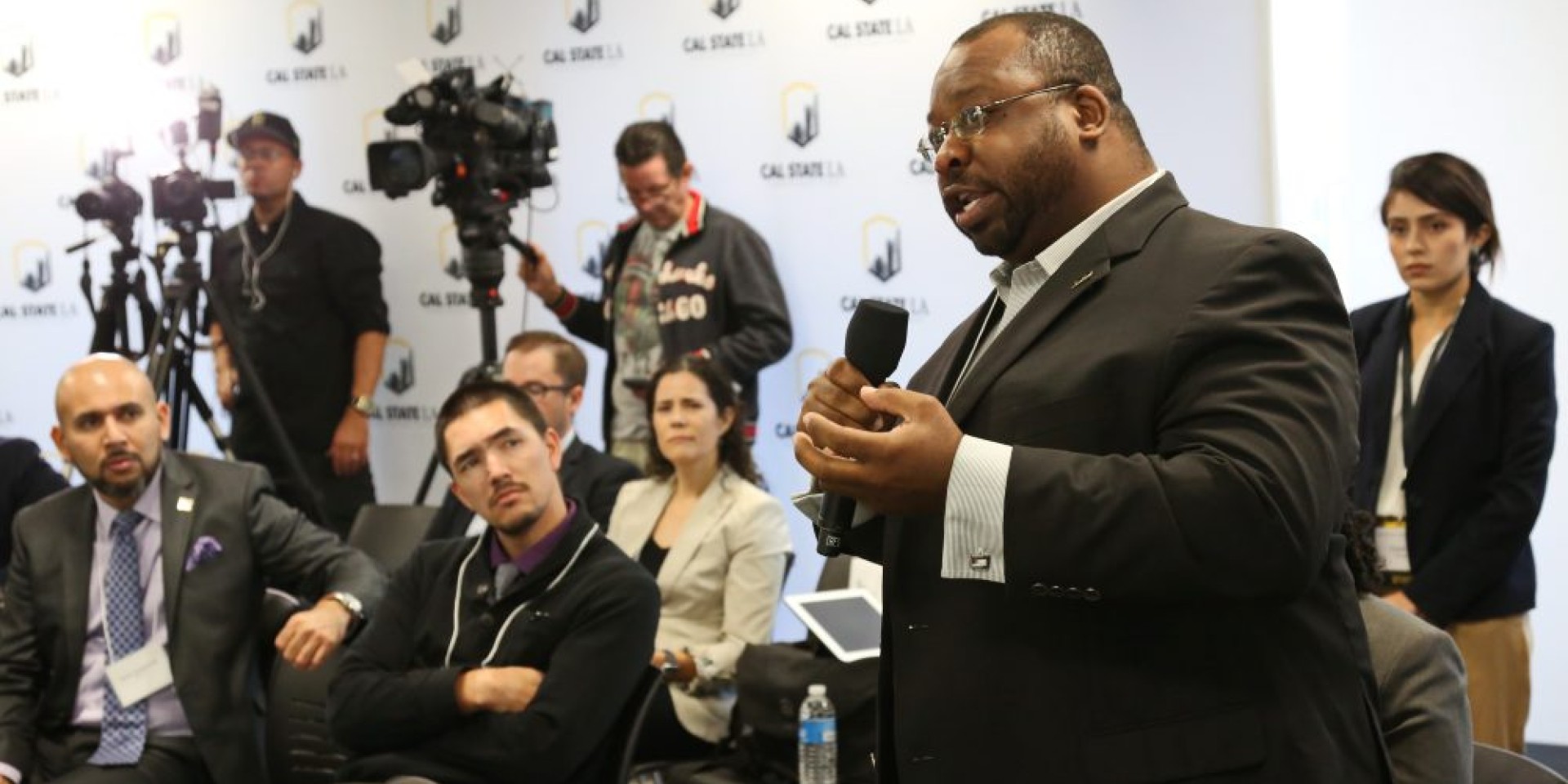 Latino Poll speaker engaged in presentation