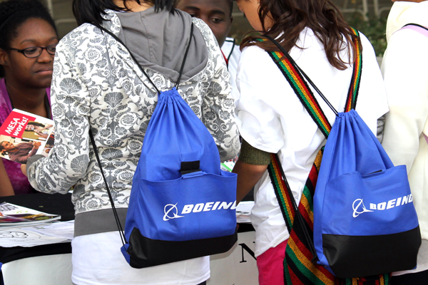 kids wearing Boeing bags