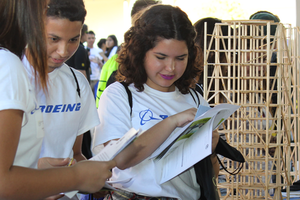 students stand by CE stick building project