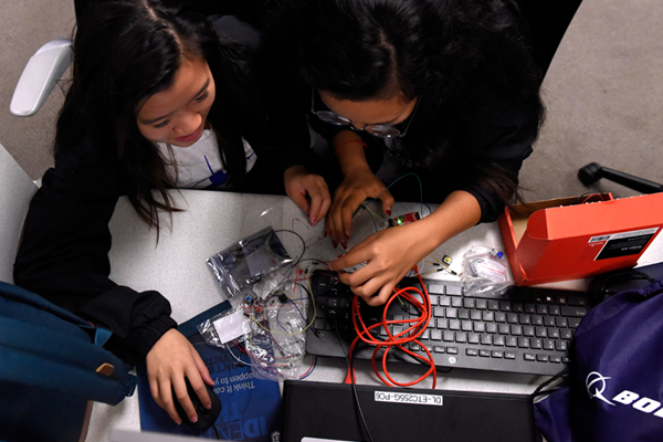 hands over keyboard in lab